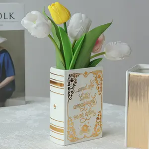 Vaso di fiori a forma di libro in ceramica dipinta in oro nordico all'ingrosso personalizzato per la decorazione domestica