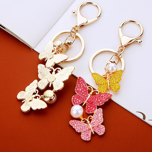 พวงกุญแจรูปผีเสื้อประดับเพชรระยิบระยับ วัสดุโลหะผสม ตกแต่งด้วยไข่มุก ใช้เป็นจี้ห้อยกระเป๋าหรูหรา พร้อมอุปกรณ์เสริมสำหรับพวงกุญแจและกระเป๋า - Product Image 2