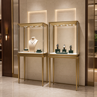 Vitrine murale pour montres et bijoux, or champagne, acier inoxydable, panneau imitation bois, velours ambré, LED, fabricant sur mesure