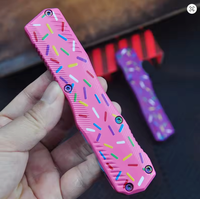Couteau de poche à double action 9000, manche en alliage de zinc rose avec motif de beignets colorés, lame recouverte de Cerakote bleu, outil de coupe EDC