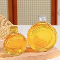 Luxe 50ml 100ml 200ml 250ml cilindrische glazen drankenverpakking voor sap, wodka, wijn, lege fles met schroefdop en zeefdruk