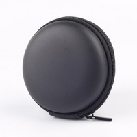 Vente en gros de sac de rangement pour casque rond EVA avec fermeture à glissière zéro portefeuille étui pour casque portable pour câble de données