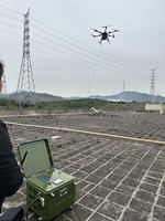 Système de drone matriciel 350 RTK avec câble rétractable automatique pour le nettoyage de fenêtres et le lavage des façades de bâtiments