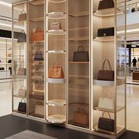 Automatische 360° Rotierende LED-Beleuchtung Vitrine für Handtaschen Moderne Einzelhandels-Ausstellungsraum-Präsentation Aluminiumlegierungsrahmen Maßgefertigte Größe Taschen-Display