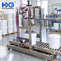 Machine de capsulage pneumatique semi-automatique durable pour seaux et fûts en plastique, avec presse à liquide et alimentateur de table à vide d'air