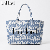Sac fourre-tout en toile camouflage pour accessoires de voyage, avec ouverture supérieure et poignées en tissu, idéal pour un transport décontracté