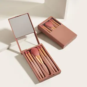 Reisegröße 5 Stück tragbares Taschen-Softhaarpulver Synthetische Breschen rosa pfirsichblau Miniklein-Größe Make-Up-Pinsel-Set mit Spiegel