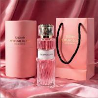 Vente en gros d'usine, flacon de parfum en verre transparent avec étiquette personnalisée, 100 ml, 50 ml, flacon en verre vide avec boîte en tube de papier et sac pour femmes