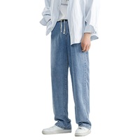 Jeans noirs baggy pour homme, taille mi-haute, style hip-hop vintage, en denim.