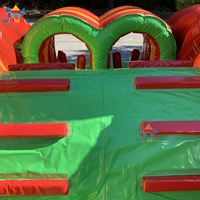 Parcours d'obstacles gonflable commercial Dinosaure 2026 avec grand toboggan en PVC pour usage public en centre commercial, idéal pour le divertissement