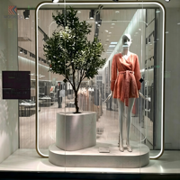 Support de présentation de vêtements minimaliste en métal rotatif et détachable, avec anneau lumineux LED, piédestal moderne pour boutique, présentoir à vêtements
