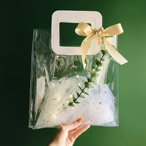 Fancy cheap pvc plastic gift bag transparent wedding souvenir candle cosmetic gift set tote bag with square round leather handle