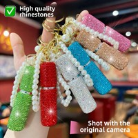 Mini flacon de parfum portable populaire incrusté de diamants, porte-clés avec chaîne de perles et strass, vaporisateur à pression pour accessoire de sac féminin