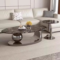 Table basse moderne italienne en acier inoxydable avec lampe ovale en marbre naturel élégante pour le salon et les espaces de réception