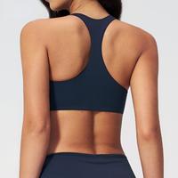 Soutien-gorge de sport pour femme avec dos sculpté, bandes latérales, coussinets amovibles, ourlet incurvé, idéal pour le yoga, l'entraînement, le fitness et la course à pied
