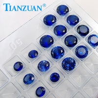 Pierres précieuses en vrac de corindon de couleur saphir bleu synthétique de laboratoire taillé en diamant de forme ronde avec des inclusions visibles