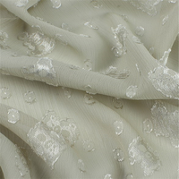 Tissu jacquard froissé en mousseline de soie Tissu de fleurs coupées panda brillant Tissu de pantalon de chemise habillée