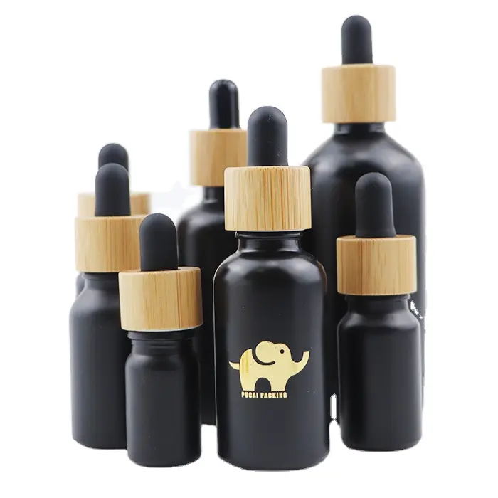 Botol Minyak Esensial Rambut Kutikula Kosmetik 30 Ml 1 Oz Kosong 30 Ml Botol Penetes Kaca Hitam Beku dengan Tutup Atas Bambu