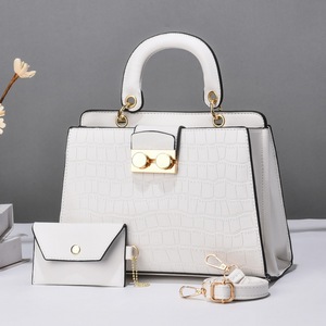 2025 Hot Sale Luxury Korean Ladies Handbag Medium PU Leather Casual Tote Top Handle Zipper Closure PVC Featuring Logo Two Straps - Product Image 2