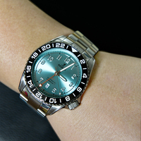 Montre GMT pour homme NH34, vente en gros ODM, plongée automatique, tachymètre, verre saphir, 20 BAR résistant à l'eau, acier inoxydable, cadran soleil.