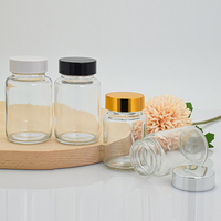 Vente en gros de bouteilles en verre rondes transparentes de 65ml 100ml bouteilles de pilules pharmaceutiques capsule de médicaments bouteilles en forme de pilules avec bouchon