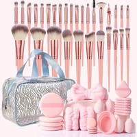 Ensemble de 55/45 pinceaux de maquillage plats en nylon avec manches en plastique, comprenant une trousse de toilette, une éponge de beauté et un houppette à poudre