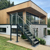 Balustrade en verre sans cadre en acier inoxydable noir sur mesure, montée latéralement, pour extérieur, avec poteau de garde-corps en verre pour maison résidentielle
