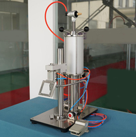 Machine de remplissage d'aérosol de bonne qualité, machine de remplissage manuelle de bombes de peinture en aérosol avec booster