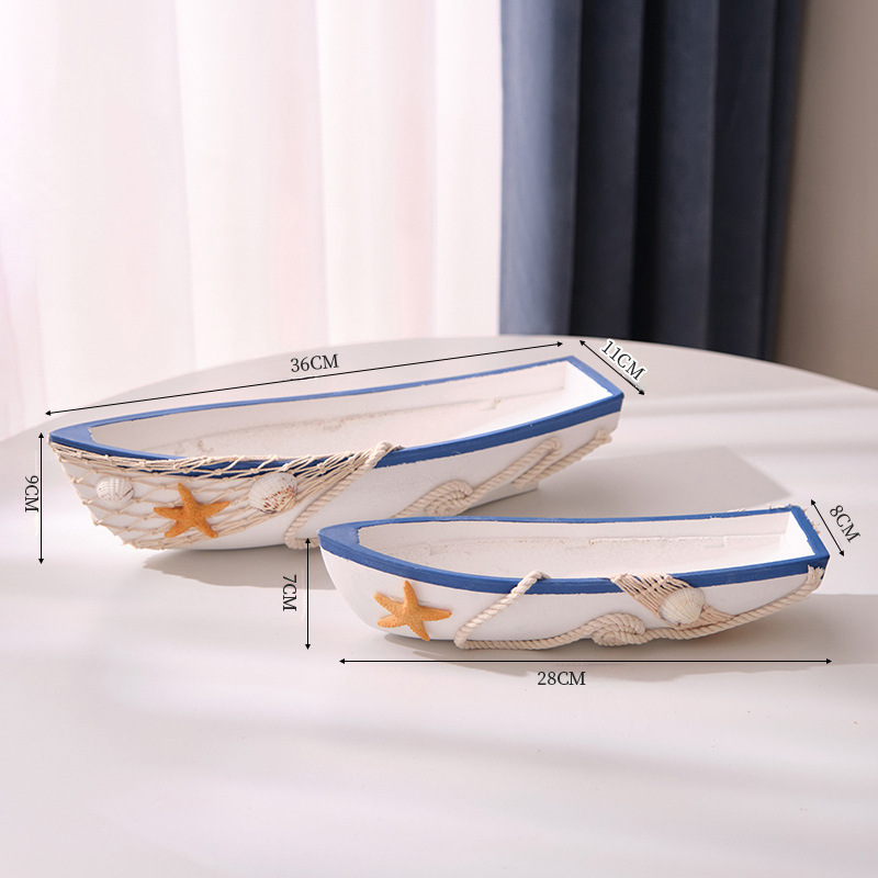 Un ensemble de deux bateaux bleus et blancs (petites et moyennes tailles)