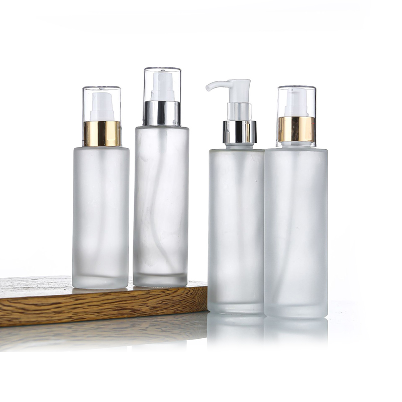 gold pump glass lotion bottle