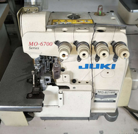Machine à coudre industrielle surjeteuse Mojuki-6500 d'occasion en bon état, point de sécurité, plateau plat blanc, certifiée CE