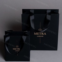 Sacs-cadeaux personnalisés en or gaufré UV de luxe doré Sacs en papier exquis pour mariage Sacs en papier noir professionnel
