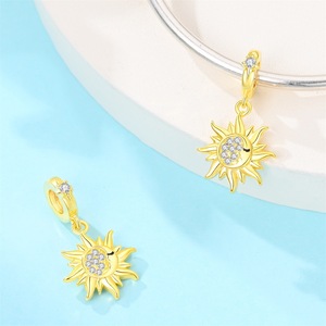 Une collection de bracelets et pendentifs en laiton blanc ornés de motifs en émail coloré - Product Image 5