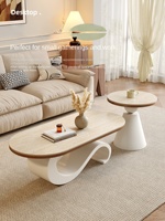 Table basse en pierre à motif ondulé artistique, style français, ton crème, design élégant et créatif pour petits salons