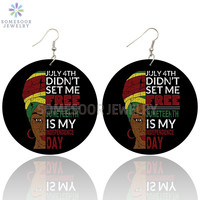 Boucles d'oreilles inspirantes en bois avec motif double face imprimé de style africain rond