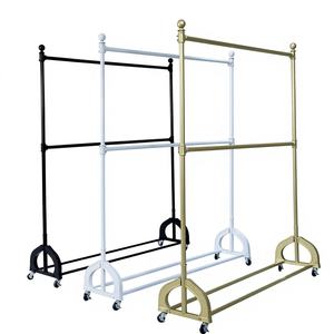 Porte-vêtements mobile à double rail avec roulettes pour les tenues des enfants et des femmes dans les boutiques - Product Image 1
