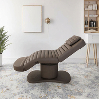 Table de massage multifonctionnelle contemporaine électrique réglable en PU pour salon de beauté et spa avec éponge haute densité