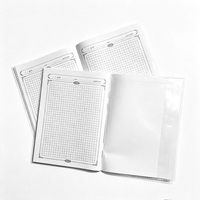 Cahier d'exercices arabe personnalisé 215x154mm avec reliure piquée à cheval et couverture transparente, pages quadrillées, impression OEM en gros