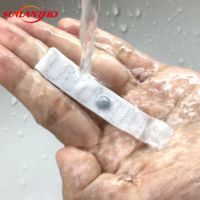 Alta temperatura impermeable UHF RFID Etiqueta de lavandería Mini Etiqueta de tela textil lavable interfaz de comunicación NFC 860-960MHz
