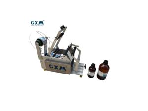 เครื่องติดฉลากขวดแบบมือหมุนสำหรับขวดพลาสติก PET และขวดแก้ว - Product Image 1