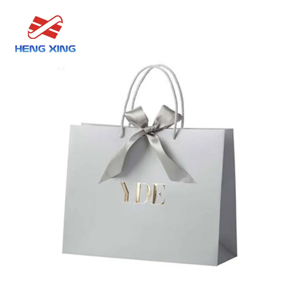 HENGXING Luxo Branco Kraft Papel Sacos De Compras Alças Personalizável Logotipo Impressão Reciclável PP Saco De Papel Plástico Fabricante