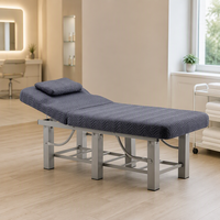 Table de massage à structure métallique avec tissu matelassé, étagère de rangement et appui-tête réglable pour salon, clinique, salle de sport
