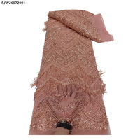 Tissu en dentelle française en tulle nigérian brodé de fleurs, orné de perles, de paillettes et de franges, lourd et élégant