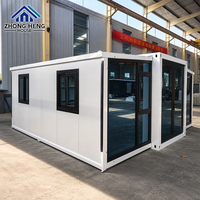 Maison modulaire extensible à double aile de 20, 30 ou 40 pieds avec porte d'entrée centrale en verre pour maison-conteneur de jardin