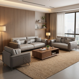 Divano in Pelle Grigia per Area Relax Ufficio con Illuminazione Ambientale Calda e Seduta Confortevole per Spazi Lounge Aziendali - Product Image 1