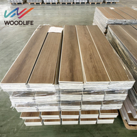 Beliebte weiße dunkelgraue Eiche 6mm dicke wasserdichte Fischgräten muster Fishbone Click SPC Floor ing Plank