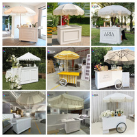 LEDA Nouveau design Chariot à dessert en acrylique blanc Chariot alimentaire mobile avec roues Parasol géant pour la décoration de mariage