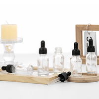 Bouteille cosmétique en verre dépoli transparent de 15ml personnalisée avec pipette compte-gouttes vide en or noir blanc pour sérum à l'huile et crème de soin de la peau