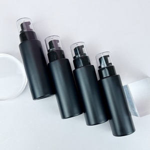 Fancy <b>Empty</b> Cylinder Round 30ml 50ml 60ml 100ml 120ml Matte Black Glass Cosmetic Emulsion Bottles Packaging With Pump - Product Image 1