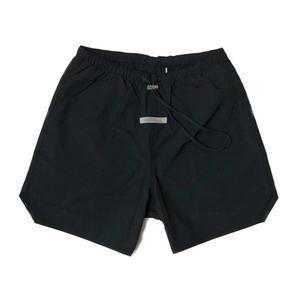 กางเกงขาสั้นผ้ายืดสะท้อนแสงสำหรับผู้ชายแห้งเร็วระบายอากาศได้ดีแบบลำลองมีเชือกผูกกลางสูงสีพื้นเทคนิคการย้อมเป็นที่นิยมในยุโรปสหรัฐ - Product Image 1